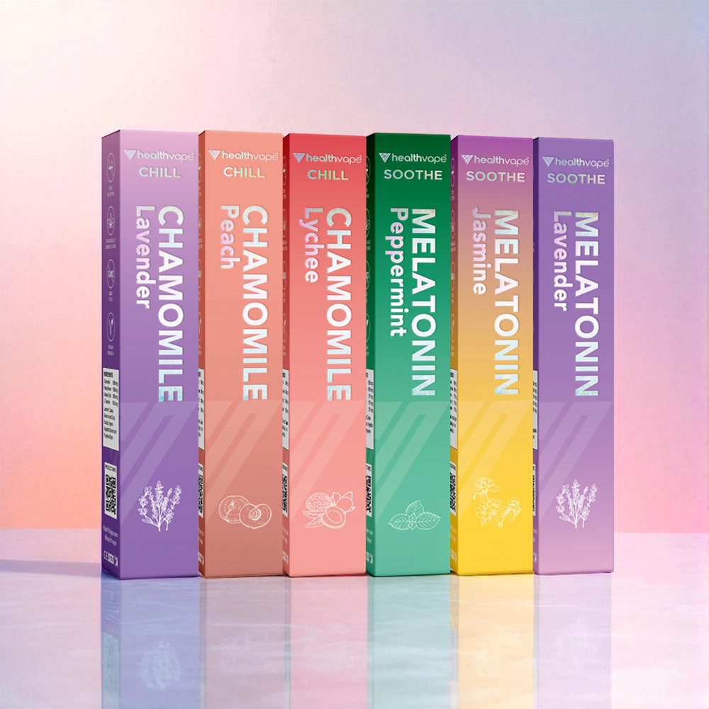 Six HealthVape CHILL and SOOTHE pens: chamomile and melatonin variety on floral background