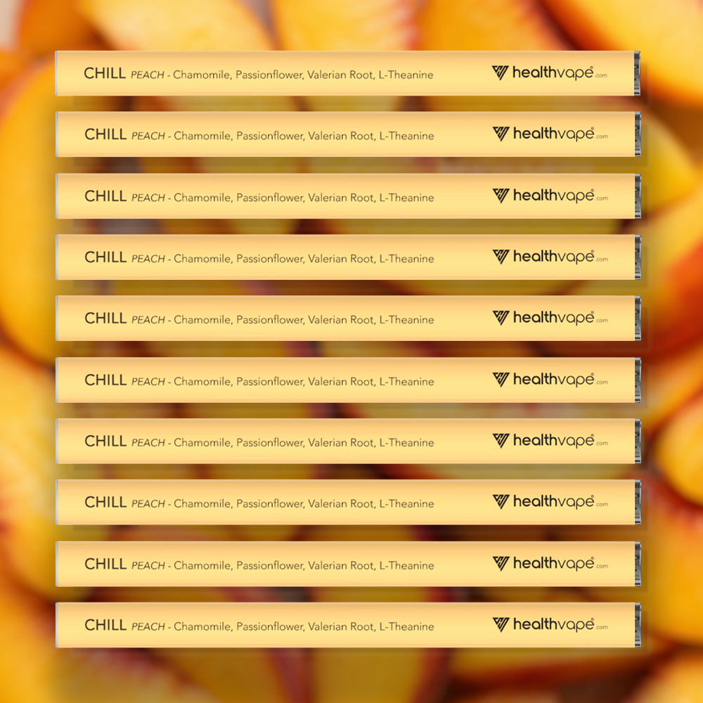 Ten HealthVape CHILL Peach chamomile pens stacked on peach background