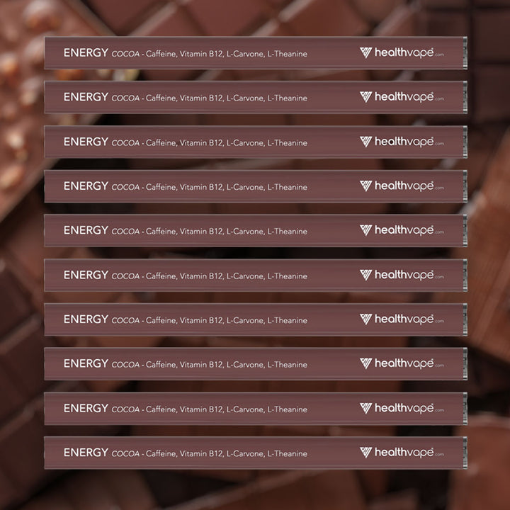 Ten HealthVape ENERGY Cocoa caffeine pens stacked on chocolate background