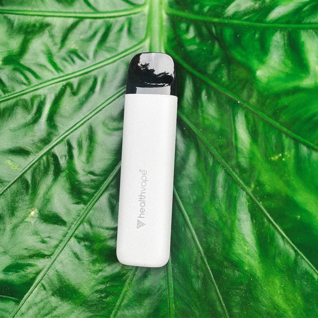 HealthVape rechargeable device standing next to pod box on a nightstand