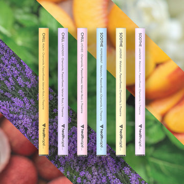 Six HealthVape CHILL and SOOTHE pens: chamomile and melatonin variety on floral background
