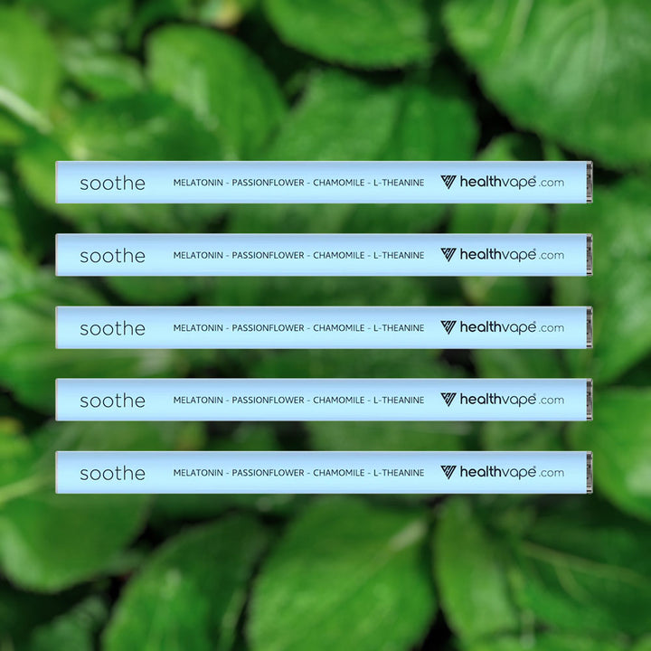 Five HealthVape SOOTHE Peppermint melatonin pens stacked on mint background