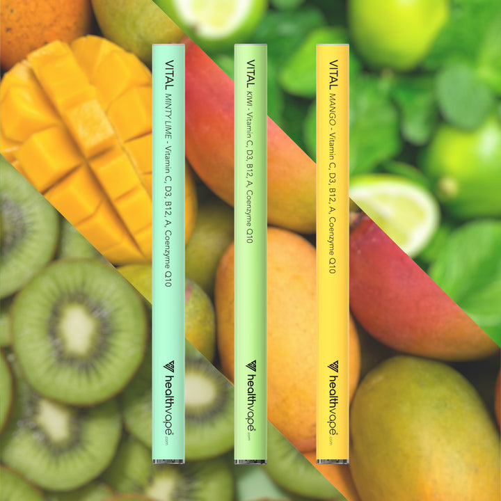 HealthVape VITAL Vitamin C bundle: Minty Lime, Kiwi, and Mango pens on fruit background