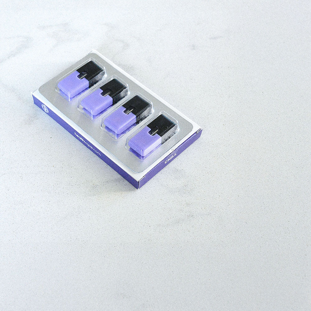 Pack of four purple and black HealthVape pods in blister tray on white surface