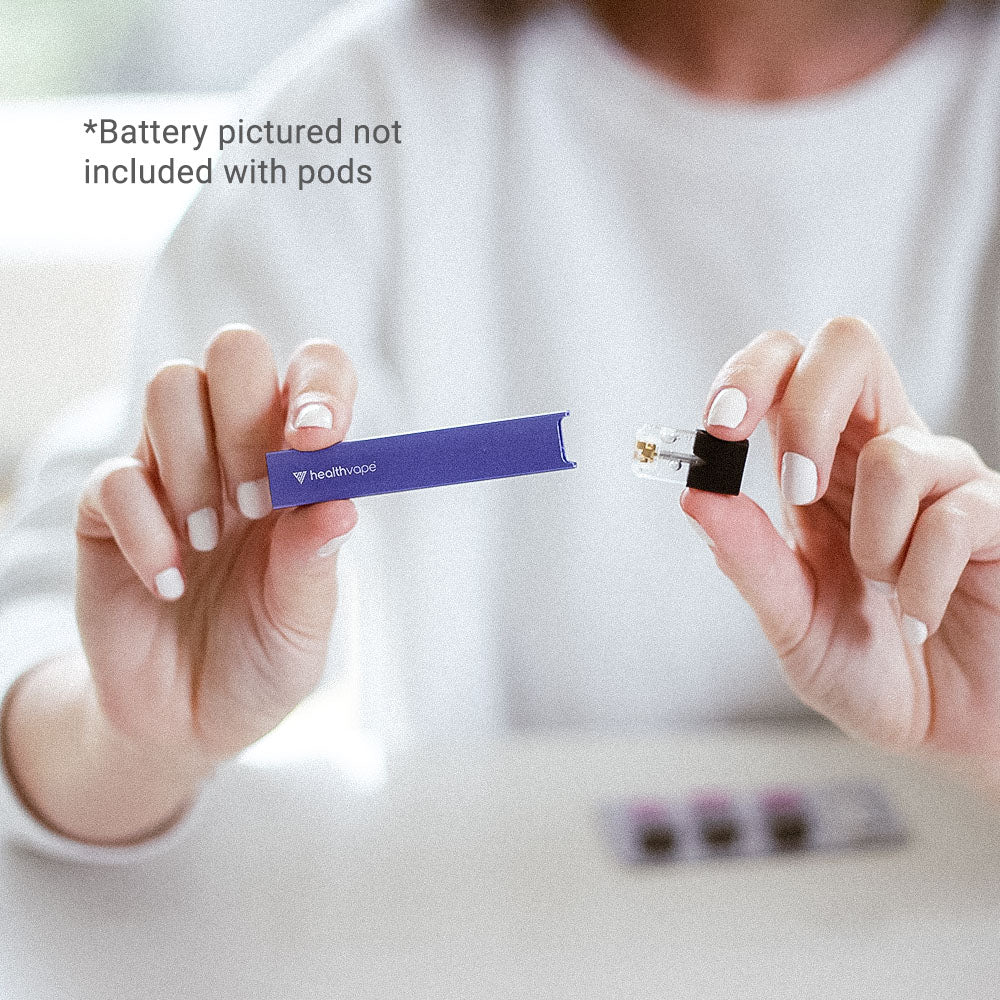 Person holding a purple HealthVape device and pod, battery not included
