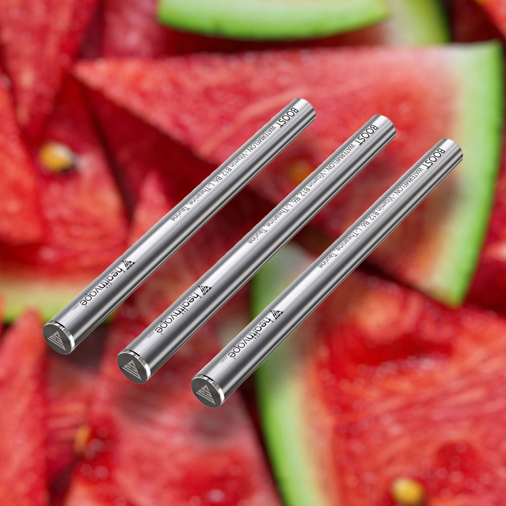 Three HealthVape BOOST Watermelon Vitamin B12 pens on watermelon background
