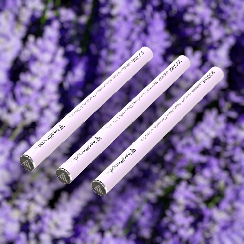 Three HealthVape SOOTHE Lavender melatonin pens on lavender flower background